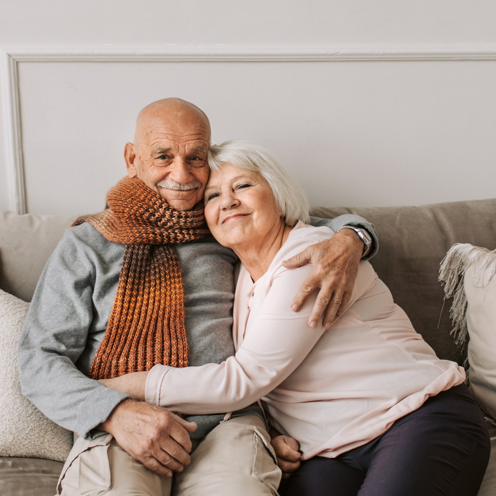 Elderly couple sits on couch during a therapy session at Tangible Therapy