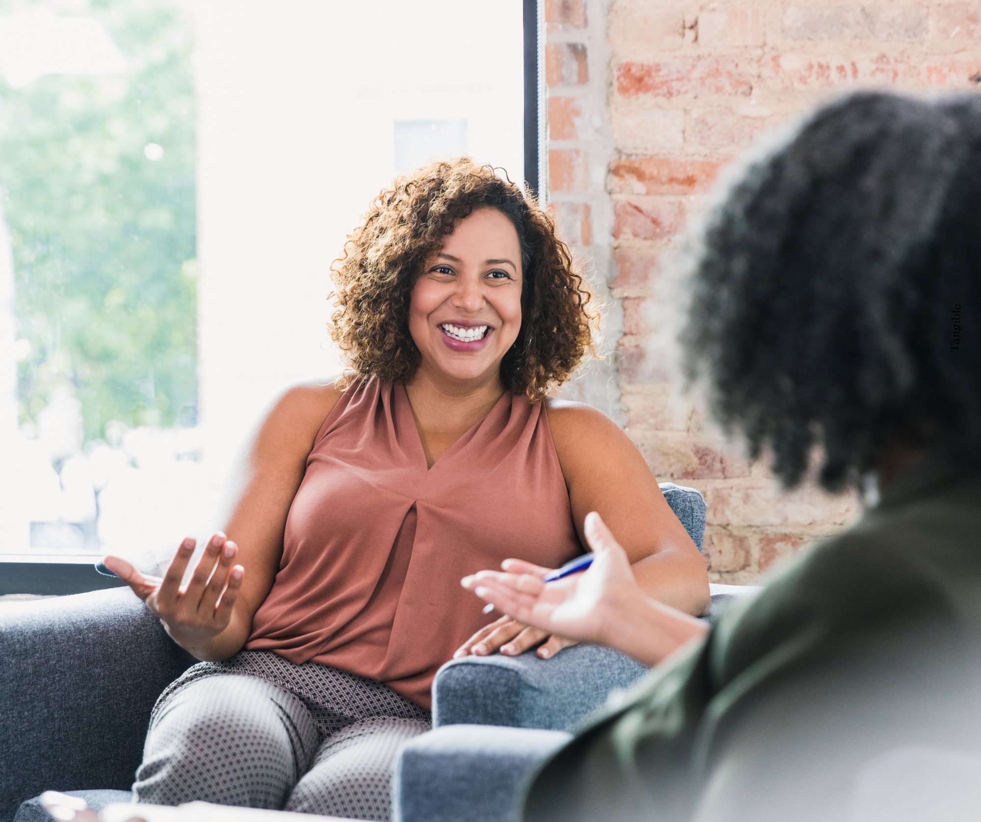 Woman sits across from a therapist for ADHD therapy at Tangible Therapy in Orem and Provo Utah